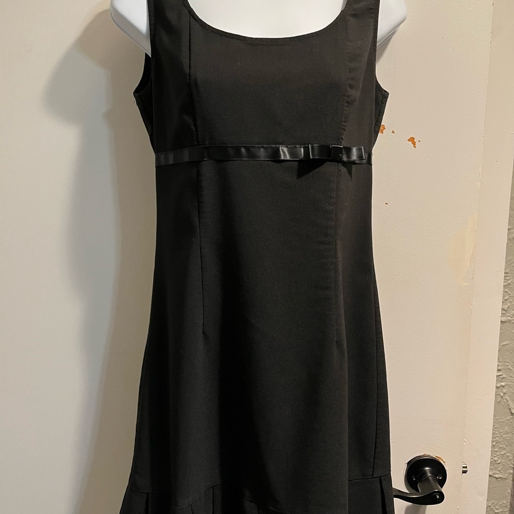 Teeze Me LBD with cute bow accent and pleated hemline. Size 7